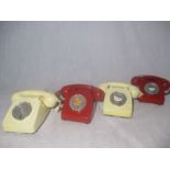 Four vintage dial telephones, two red and two cream
