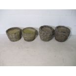 Two pairs of concrete garden pots