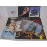 A small collection of 12" vinyl records including The Rolling Stones, Thin Lizzy, Elton John, Deep