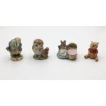 A collection of Beatrix Potter Beswick figurines comprising of "Hunca Munca", "Old Mr Brown" and "