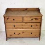 A pine chest of four drawers