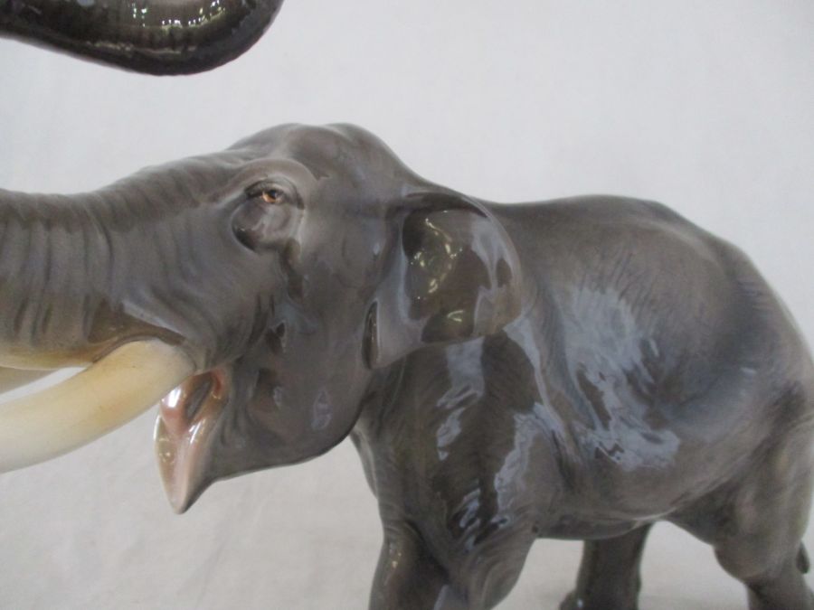 A ceramic elephant. Height 41cm. Has had a repair to one tusk. AF - Image 5 of 15