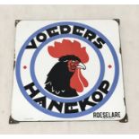 A vintage enamel advertising Dutch advertising sign for a chicken feed supplier