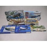 A collection of seven boxed plastic construction model kits including four Revell's (B-25