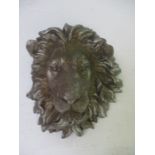 A metal wall plaque of a lions head, height 47cm