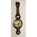 A Georgian banjo barometer, by O. Poppi of Holborn.