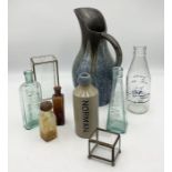 A collection of pottery and glassware including large studio pottery jug, vintage bottles etc.