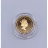 A 1/4 oz fine gold 1989 Britannia £25 coin - weigh approx 8.6 g