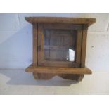 A rustic pine key cabinet