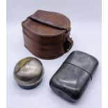 A leather horse shoe shaped collar box, pewter hip flask and a travelling inkwell with anchor and