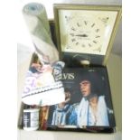 A large collection of Elvis memorabilia including a clock, mirrors and pictures, posters, tee shirt,