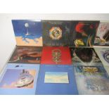 A collection of twenty seven 12" vinyl records including ELO, Dire Straits, Rick Wakeman, Camel,