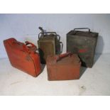 A collection of four vintage petrol cans.