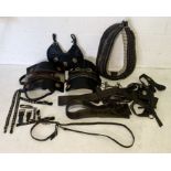 A variety of vintage heavy horse harness, straps and tack made by Fred Ball Axminster including