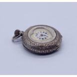 A 935 silver heart shaped fob watch with white enamelled dial with gold decoration