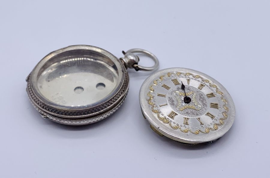 A hallmarked silver fob watch with chased silver dial- A/F