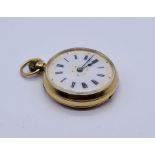 An 18ct gold fob watch with enamelled dial