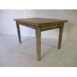 A pine farmhouse table with single drawer