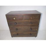 A Victorian campaign chest of five drawers