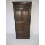 An oak panelled single wardrobe - height 180cm, width 77cm, depth 39cm