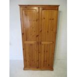 A pine two door wardrobe