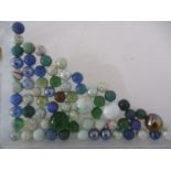 A small collection of vintage marbles