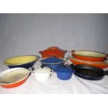 An assortment of used condition Le Creuset kitchenware