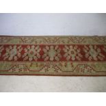 A Turkish hand woven runner. 278cm x 81cm