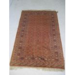 A red ground rug - overall size 190cm x 126cm