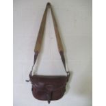 A Purdey leather cartridge bag/case with canvas shoulder strap