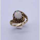 An opal ring set in 9ct gold