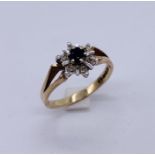 A 9ct gold diamond and sapphire cluster ring