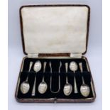 A cased set of hallmarked silver coffee spoons with sugar tongs