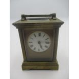 A small Victorian brass carriage clock, height 10cm