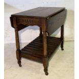 An oak Old Charm tea trolley with slatted base