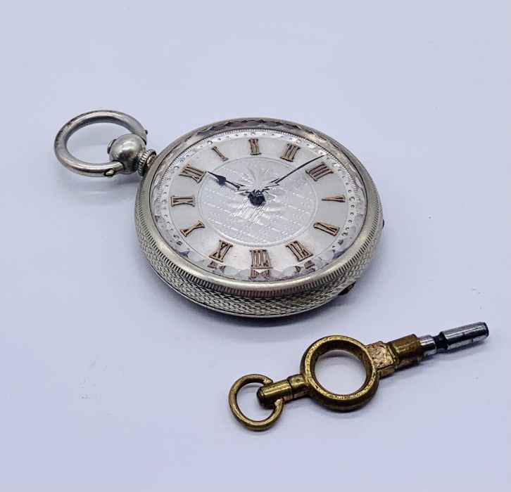 A fine silver fob watch with silvered dial