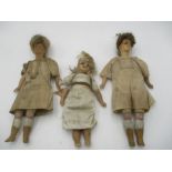 A small collection of antique wax headed dolls.