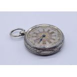 A silver fob watch marked 800, with ornate silver dial