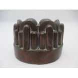 A Victorian copper jelly mould stamped 182C