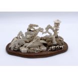 A turn of the century Japanese ivory and bone diorama of a traditional scene