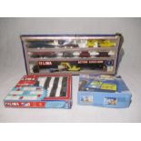 A boxed Lima model railway OO gauge Action Accessory set including a locomotive, container unloading