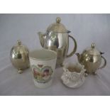 A silver plated Christopher Dresser inspired coffee pot, cream and sugar along with a Belleek floral