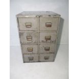 A metal filing cabinet with eight drawers, manufactured by Roneo Ltd and dated 1938. 51cm x 51cm,