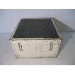 A white painted wooden trunk with metal bounding and handles. Name marked on top (Rev. John Du