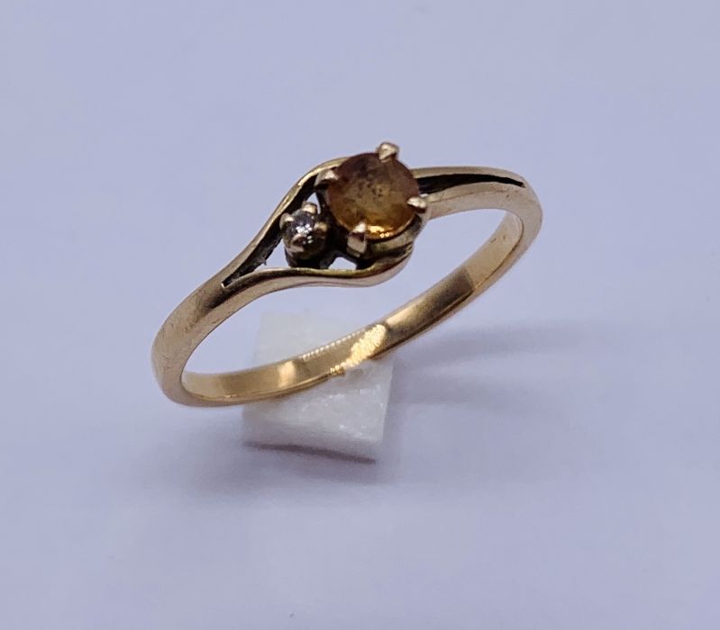 A 14ct gold ring set with a yellow Topaz