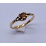 A 14ct gold ring set with a yellow Topaz