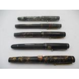 A collection of five vintage fountain pens including Cadet, Mentmore, etc.