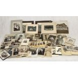 A large collection of vintage photographs and other ephemera