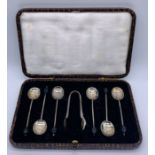 A cased set of hallmarked silver coffee bean spoons