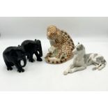 A ceramic USSR marked leopard and dog (possibly Great Dane) along with two wooden elephants